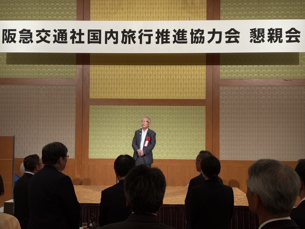 懇親会であいさつする松田会長